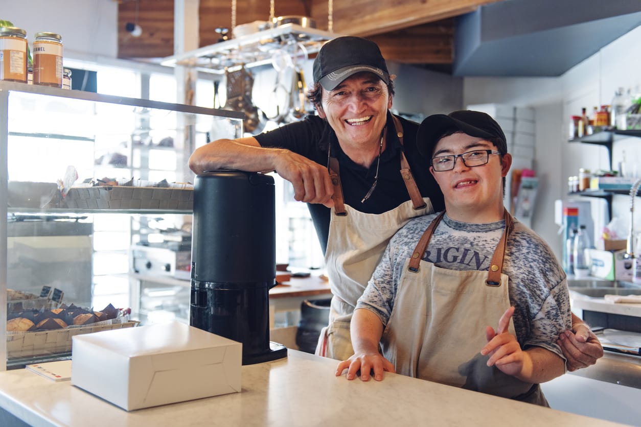 down syndrome boy working in coffee shop